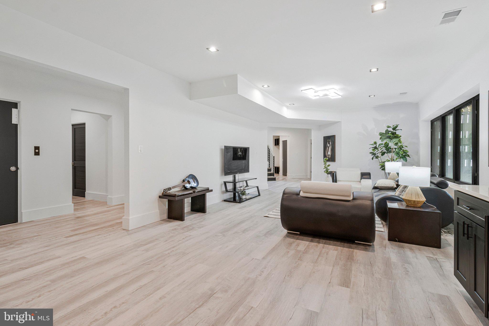 3525 Glenbrook Road Fairfax, VA 22031 - Photo 69 of 111 a living room with furniture and a wooden floor