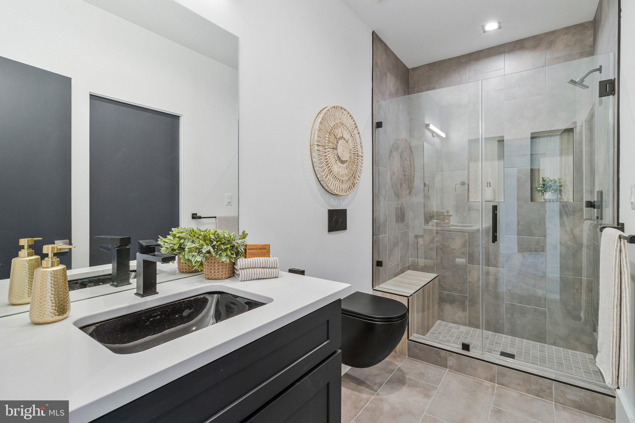 3525 Glenbrook Road Fairfax, VA 22031 - Photo 89 of 111 a bathroom with a sink a toilet and shower