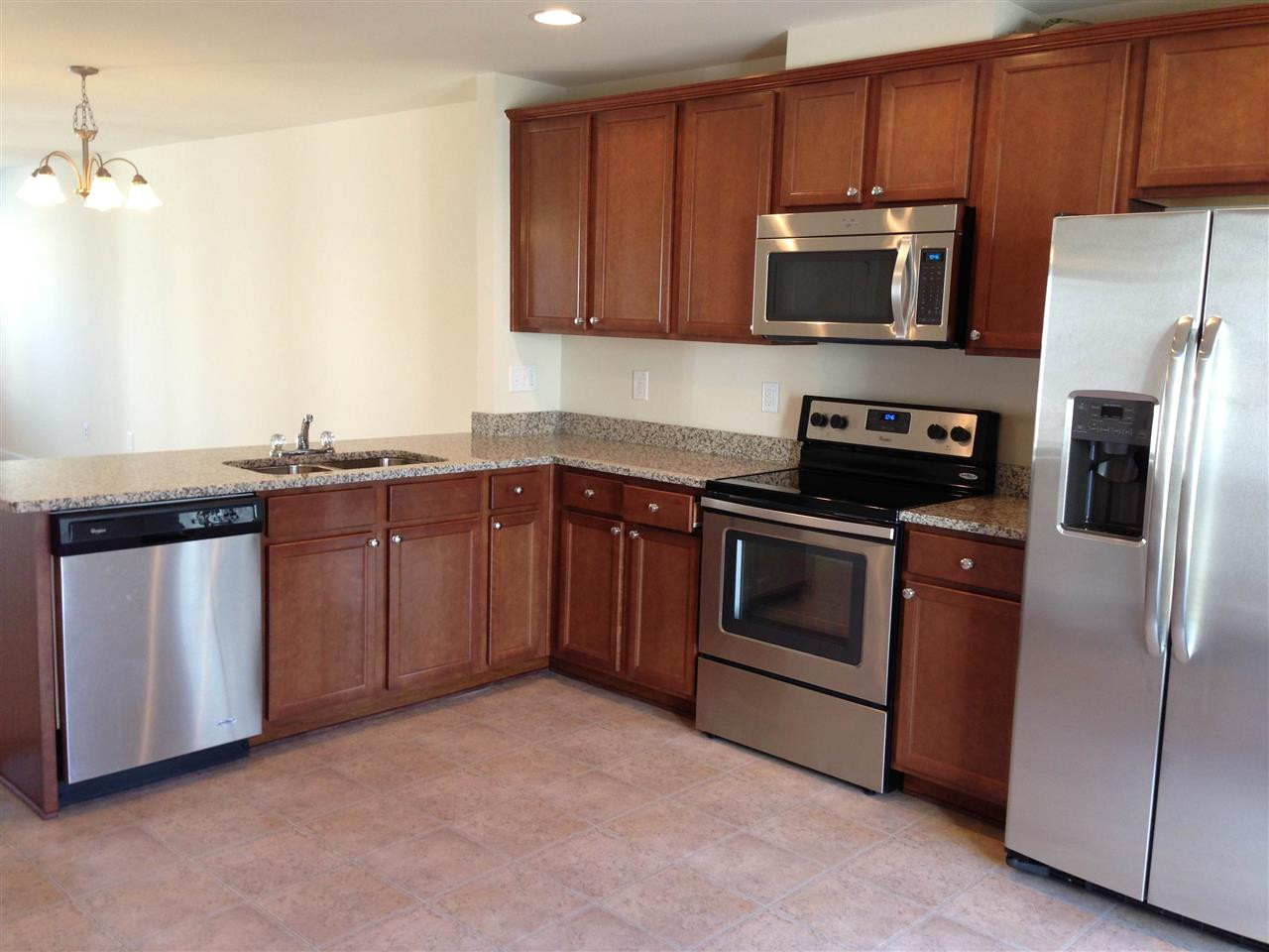 3906 Swinton Street Raleigh, NC 27616 - Photo 4 of 21 Stainless steel appliances and Granite counter tops