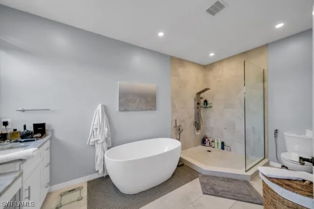 a bathroom with a bathtub and a sink