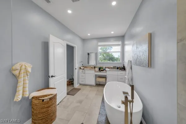 a living room with furniture a window and gym equipment