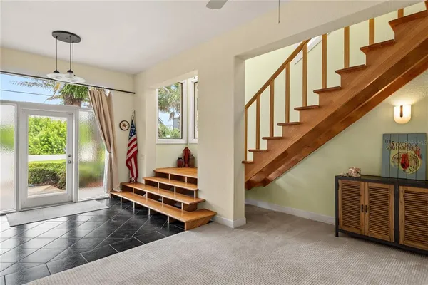 a view of entryway and hall with wooden floor