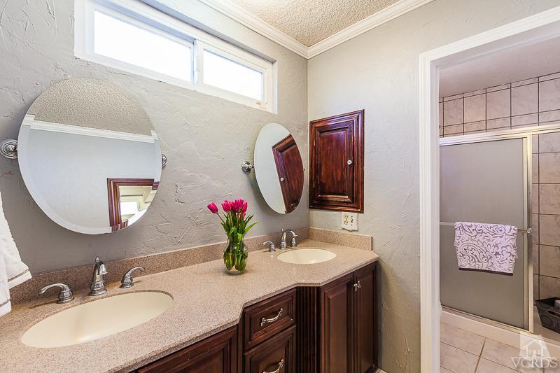 1291 Old Ranch Road Camarillo, CA 93012 - Photo 17 of 41 a bathroom with a sink vanity and a mirror