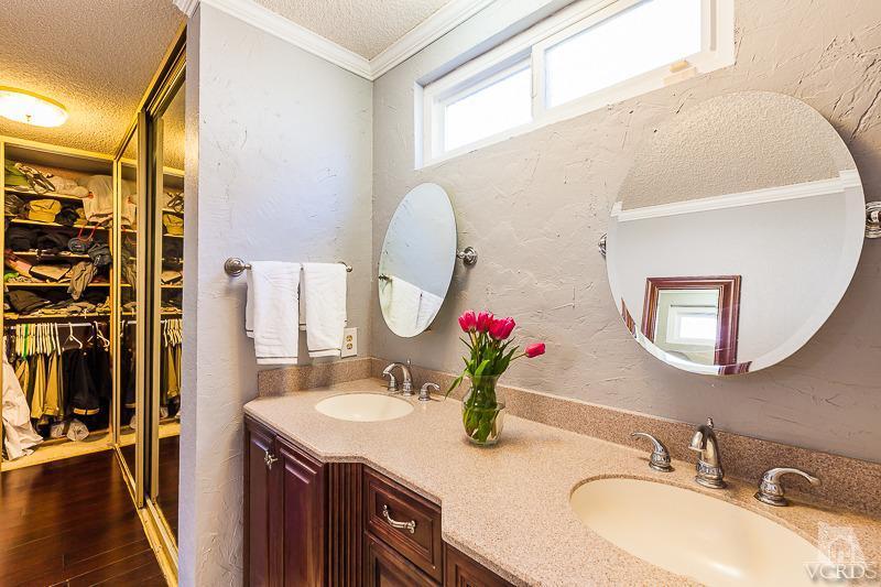1291 Old Ranch Road Camarillo, CA 93012 - Photo 18 of 41 a bathroom with a granite countertop sink and a mirror