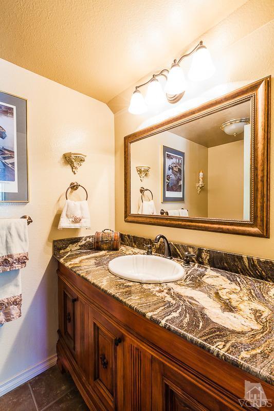 1291 Old Ranch Road Camarillo, CA 93012 - Photo 19 of 41 a bathroom with a granite countertop sink and a mirror