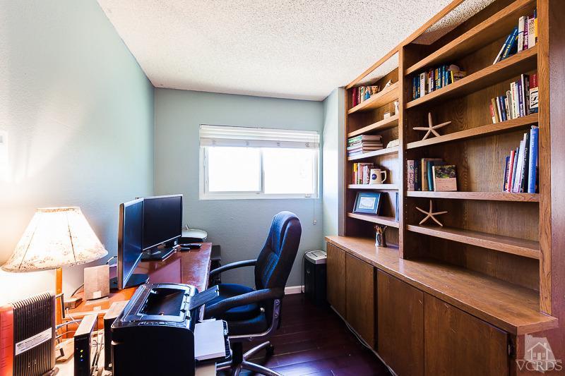 1291 Old Ranch Road Camarillo, CA 93012 - Photo 22 of 41 a view of a workspace with furniture and a book shelf