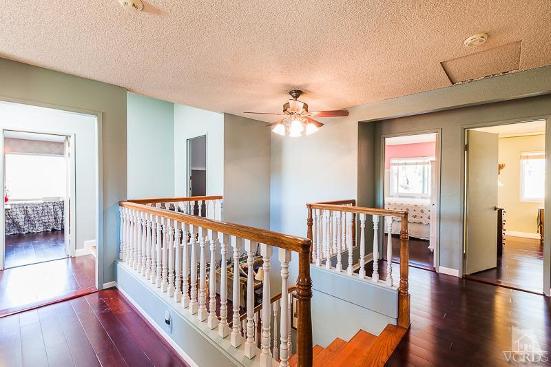 1291 Old Ranch Road Camarillo, CA 93012 - Photo 23 of 41 a view of a hallway with wooden floor and windows