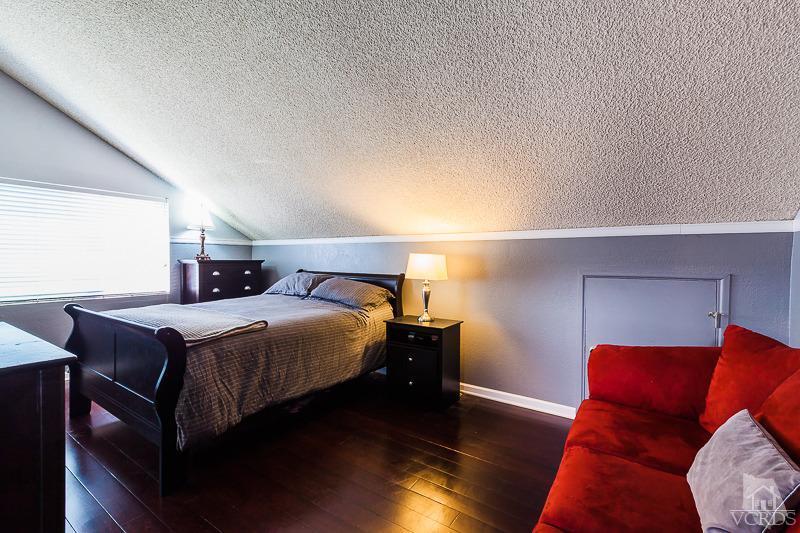 1291 Old Ranch Road Camarillo, CA 93012 - Photo 24 of 41 a bedroom with a bed and wooden floor
