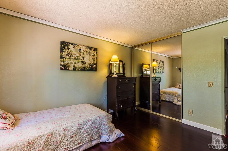 1291 Old Ranch Road Camarillo, CA 93012 - Photo 30 of 41 a bedroom with a bed and wooden floor