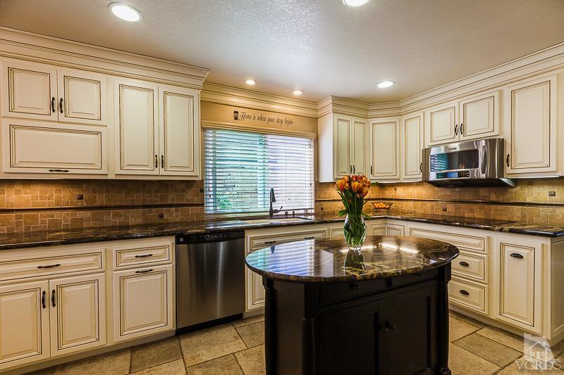 1291 Old Ranch Road Camarillo, CA 93012 - Photo 3 of 41 a kitchen with stainless steel appliances granite countertop a sink a stove and cabinets