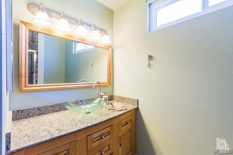 1291 Old Ranch Road Camarillo, CA 93012 - Photo 32 of 41 a bathroom with a granite countertop sink and a mirror