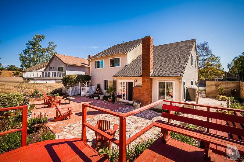 1291 Old Ranch Road Camarillo, CA 93012 - Photo 35 of 41 a view of a patio with couches table and chairs under an umbrella with a barbeque