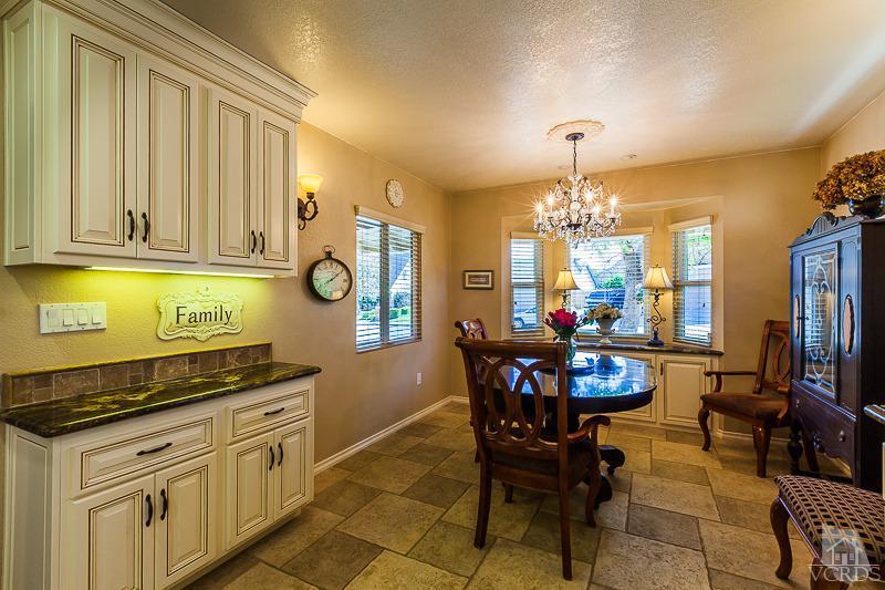 1291 Old Ranch Road Camarillo, CA 93012 - Photo 4 of 41 a kitchen with stainless steel appliances granite countertop a stove a sink dishwasher and a dining table with garden view