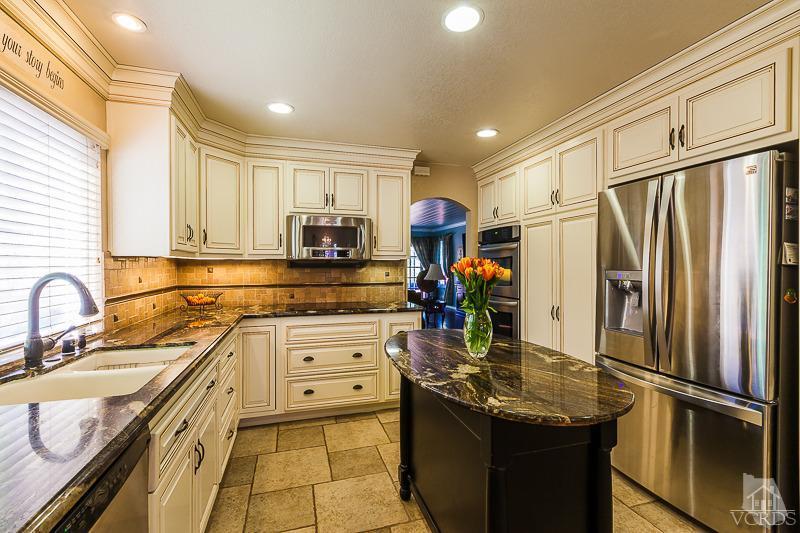 1291 Old Ranch Road Camarillo, CA 93012 - Photo 6 of 41 a kitchen with stainless steel appliances granite countertop a sink refrigerator and cabinets