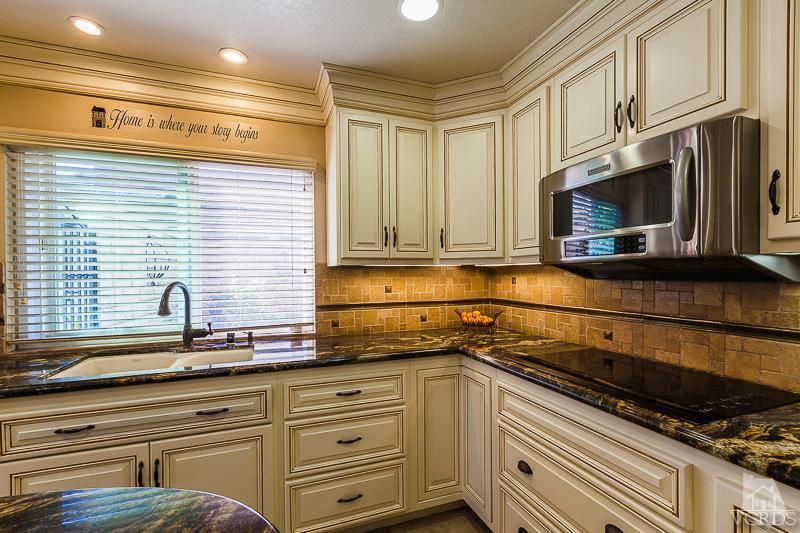 1291 Old Ranch Road Camarillo, CA 93012 - Photo 8 of 41 a kitchen with granite countertop cabinets stainless steel appliances and a sink