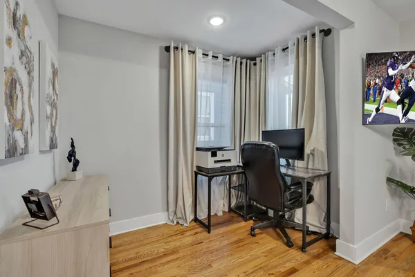 a view of a patio with table and chairs with wooden floor and fence