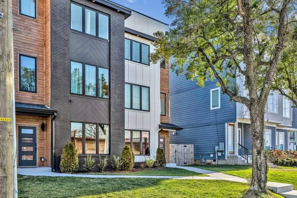 a view of a building with a yard