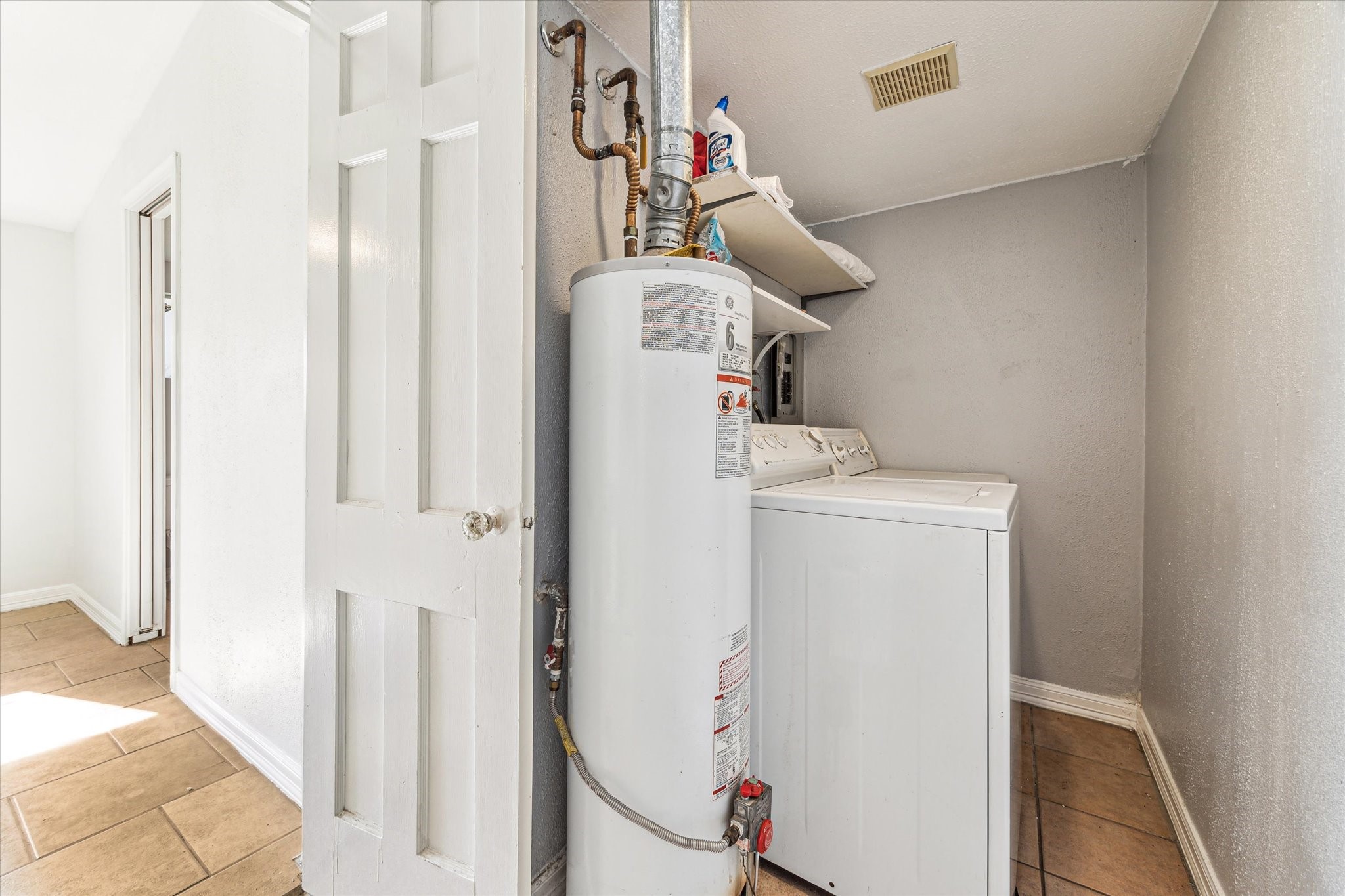 5125 Maple Street Bellaire, TX 77401 - Photo 13 of 14 a utility room with dryer and washer