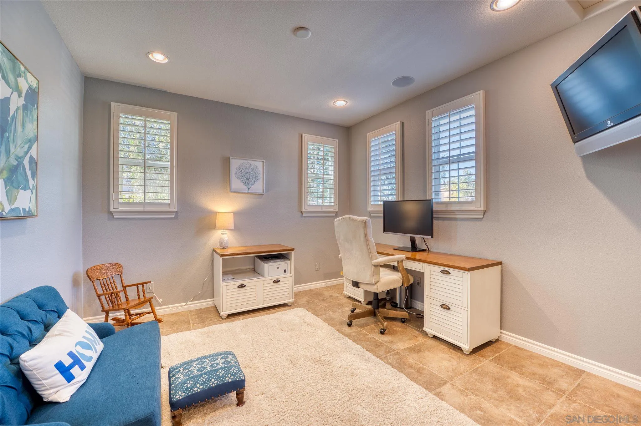 7432 Circulo Sequoia Carlsbad, CA 92009 - Photo 17 of 51 a living room with furniture and a flat screen tv