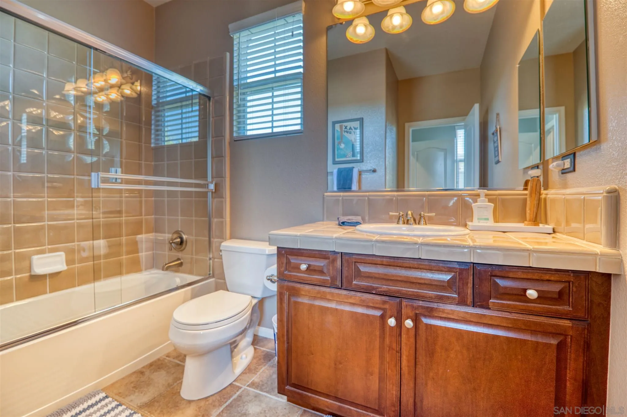 7432 Circulo Sequoia Carlsbad, CA 92009 - Photo 26 of 51 a bathroom with a sink a toilet and shower
