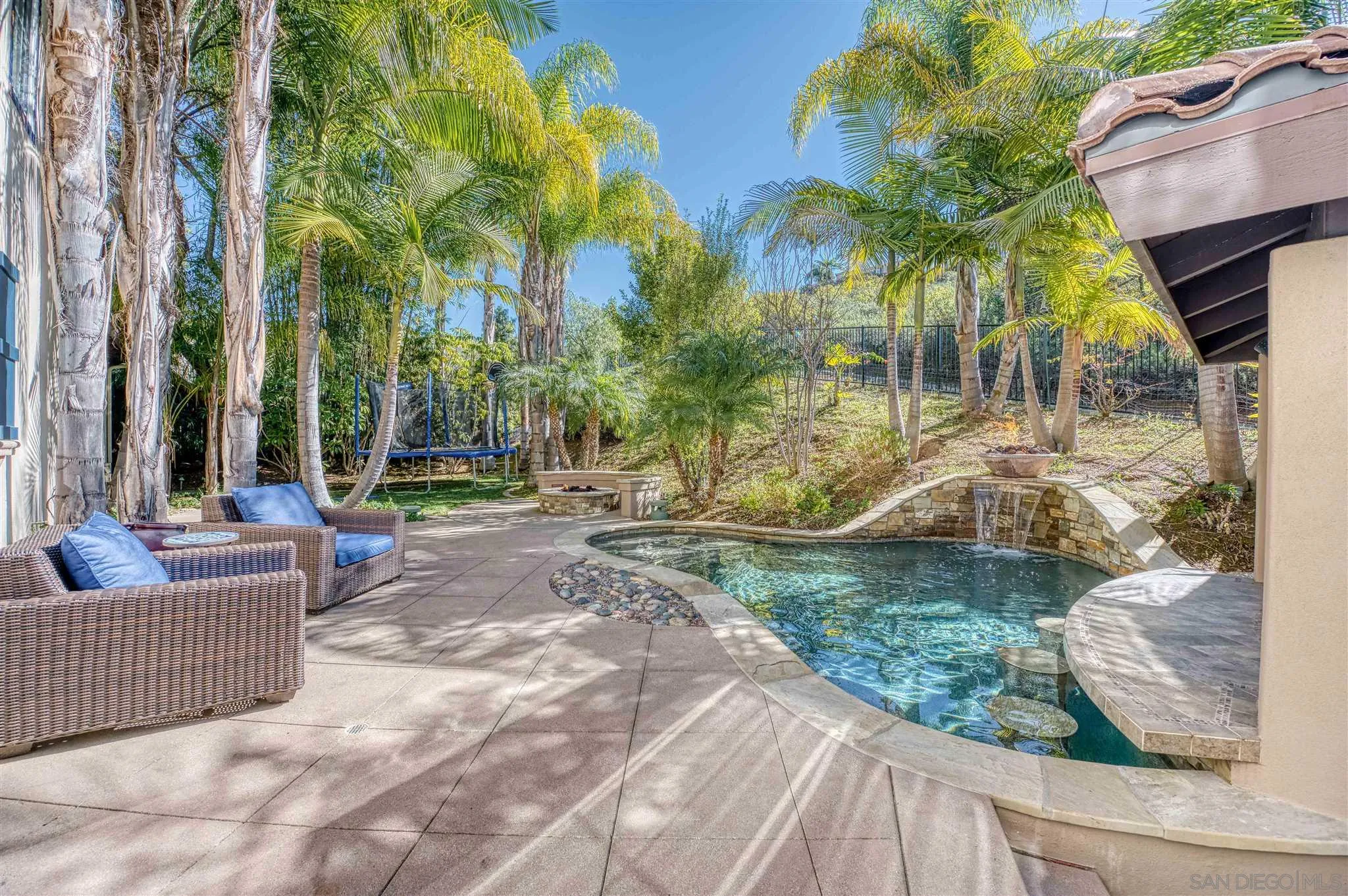 7432 Circulo Sequoia Carlsbad, CA 92009 - Photo 37 of 51 a view of a patio with couches and table and chairs and potted plants
