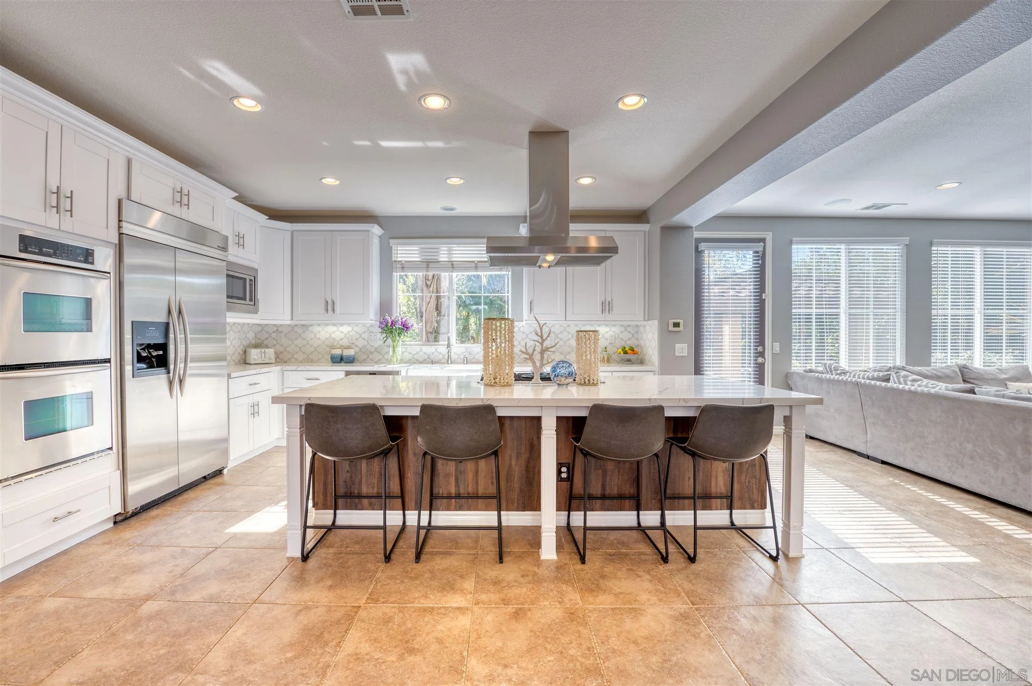 7432 Circulo Sequoia Carlsbad, CA 92009 - Photo 6 of 51 a large kitchen with a table and chairs