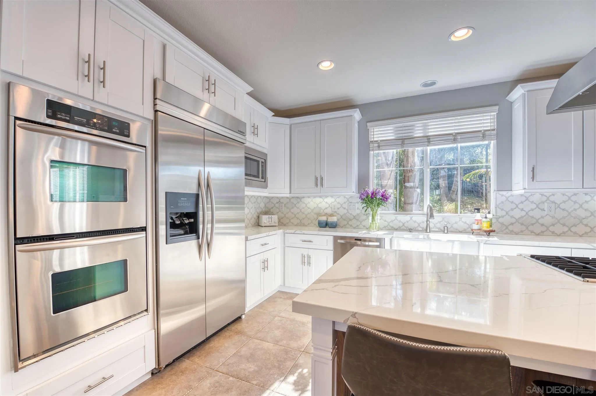 7432 Circulo Sequoia Carlsbad, CA 92009 - Photo 8 of 51 a kitchen with a refrigerator and a sink