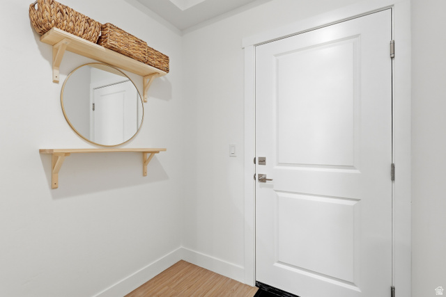 2085 North Main Street, Unit 107 Sunset, UT 84015 - Photo 2 of 21 Entryway featuring baseboards and wood finished floors