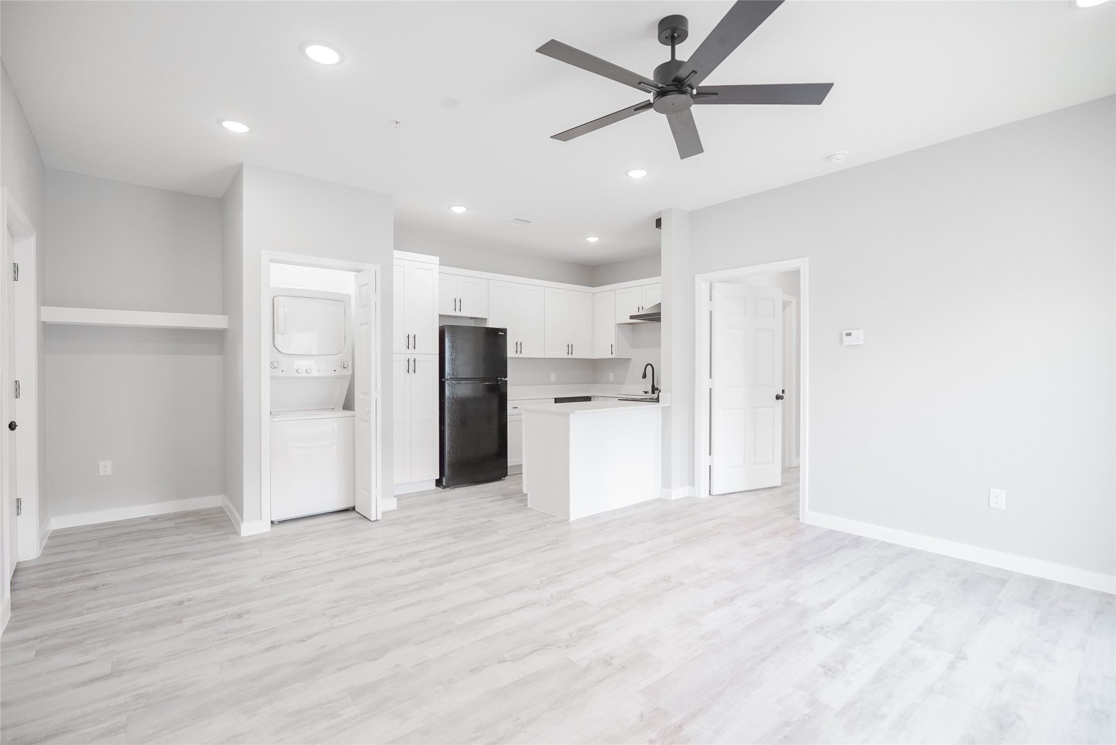 2101 Reinke Road, Unit 8212 Waller, TX 77484 - Photo 10 of 33 a view of a kitchen with a refrigerator and a sink
