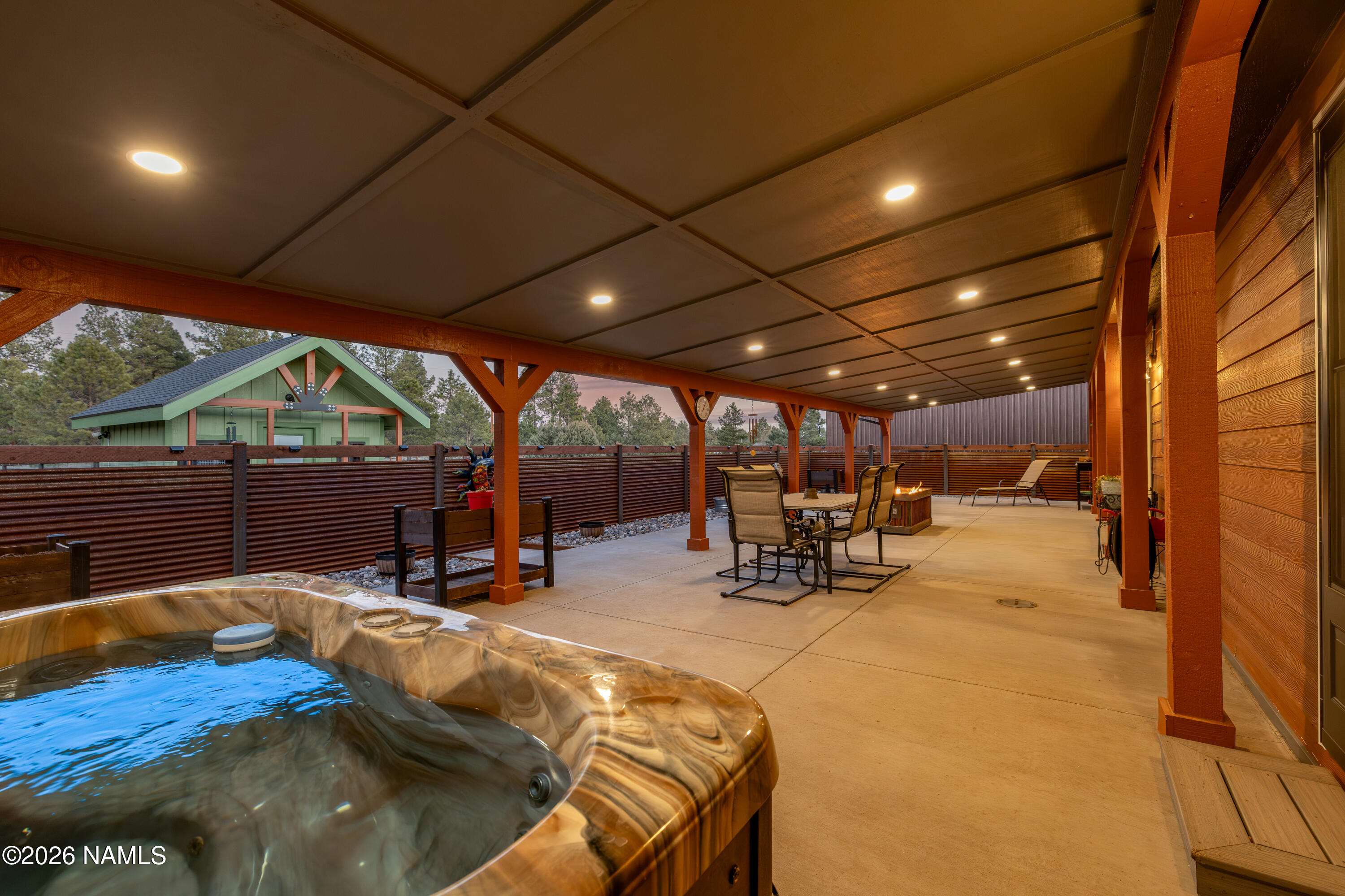 1150 North Three Bears Loop Parks, AZ 86018 - Photo 45 of 82 a view of a patio with table and chairs under an umbrella