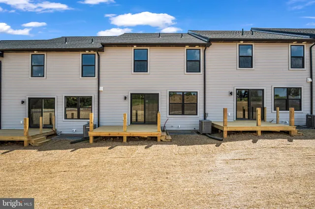 a backyard of a house with seating space