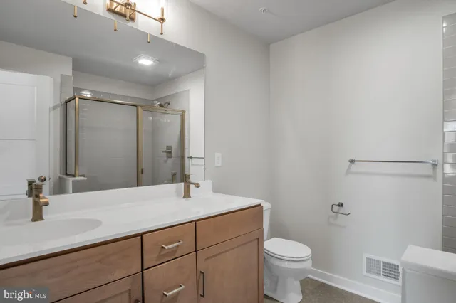 a bathroom with a glass shower door