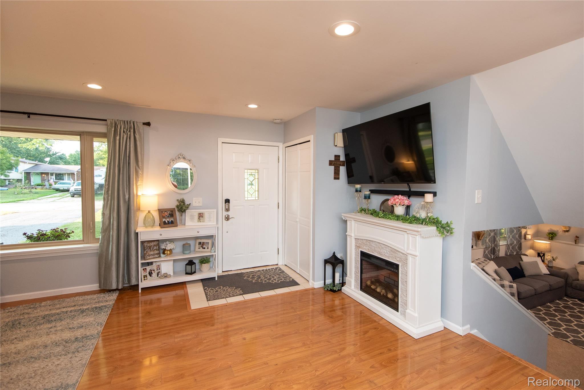4395 Regency Road Swartz Creek, MI 48473 - Photo 15 of 67 Recessed lighting, wood-finish flooring, and a decorative fireplace