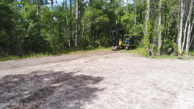 a view of outdoor space with deck and yard