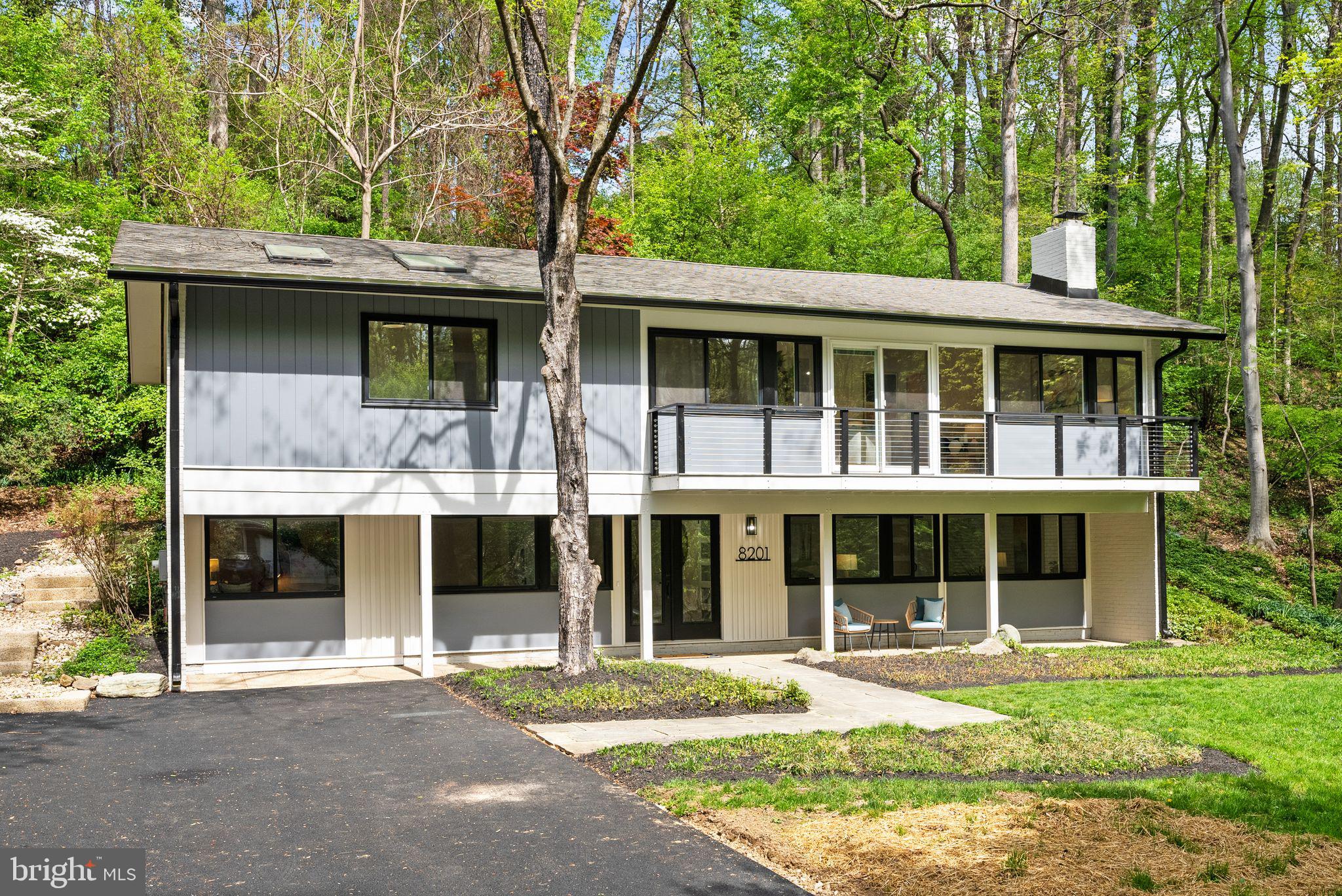 8201 Hamilton Spring Court Bethesda, MD 20817 - Photo 1 of 66 a front view of a house with a yard