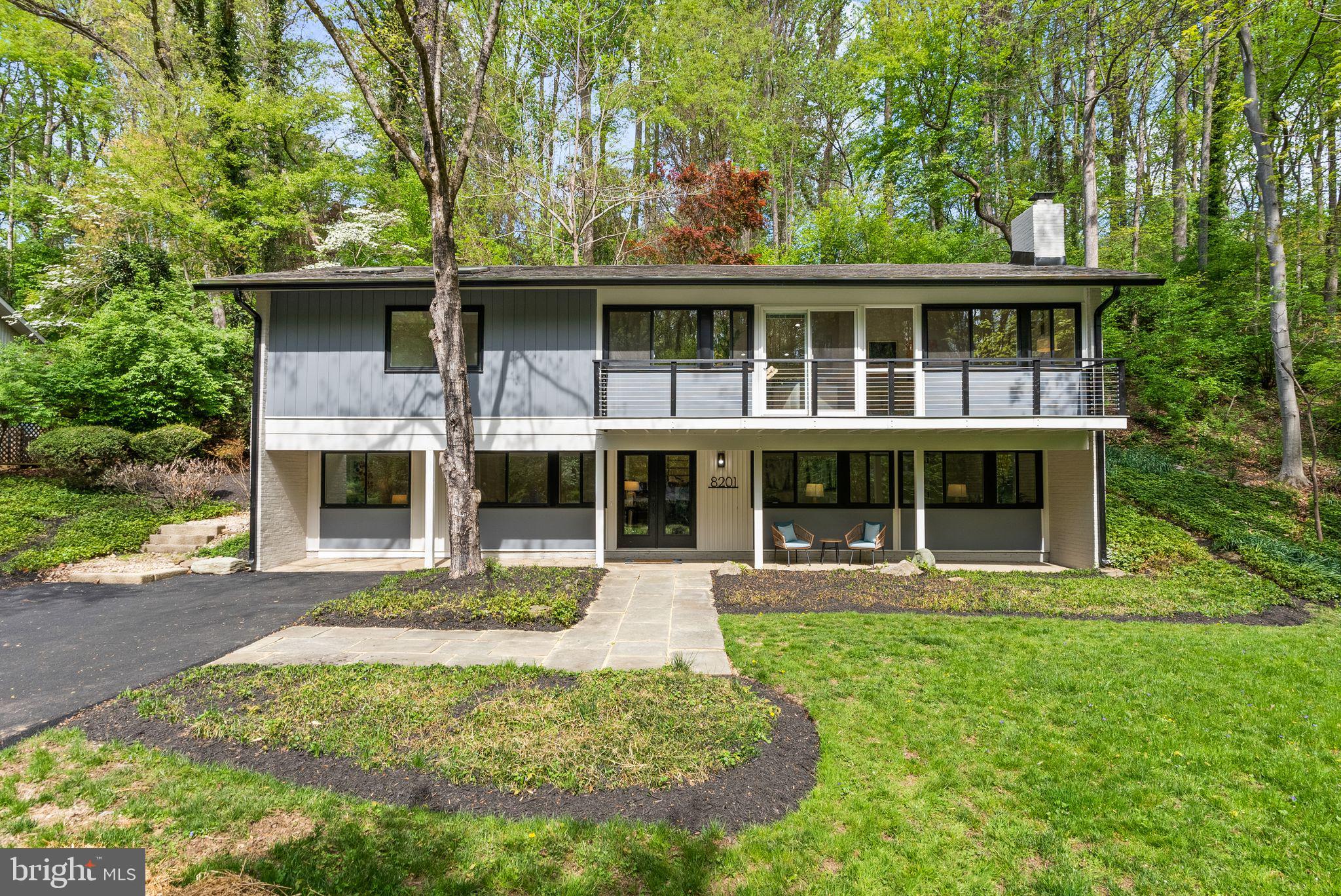 8201 Hamilton Spring Court Bethesda, MD 20817 - Photo 5 of 66 a front view of house with yard and outdoor seating