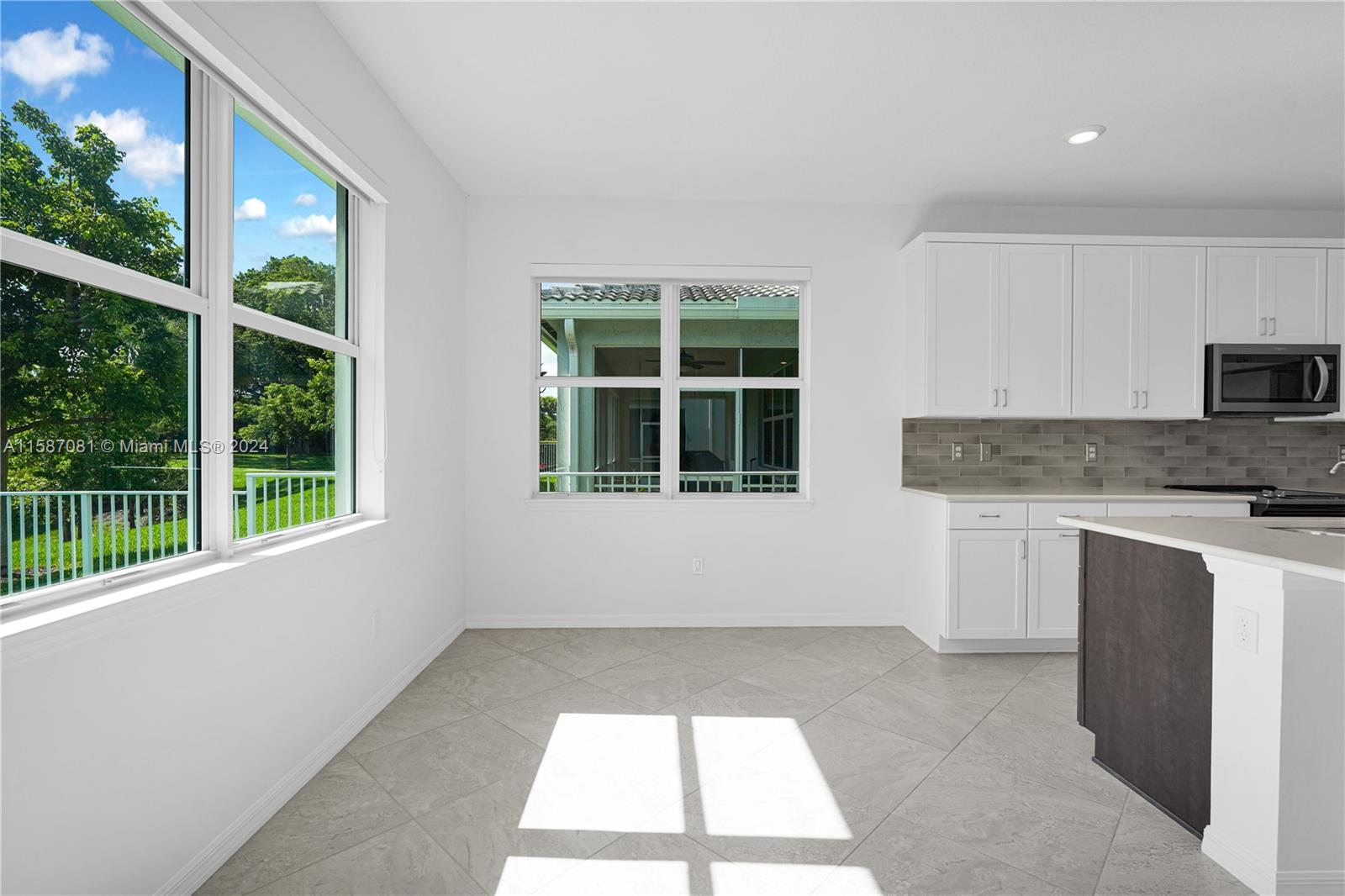 1595 Trailhead Terrace Hollywood, FL 33021 - Photo 13 of 49 a kitchen with a window a sink and a stove