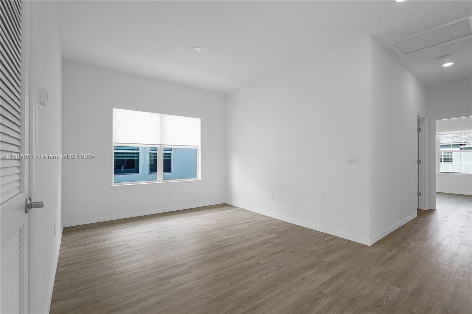 1595 Trailhead Terrace Hollywood, FL 33021 - Photo 28 of 49 an empty room with wooden floor and windows