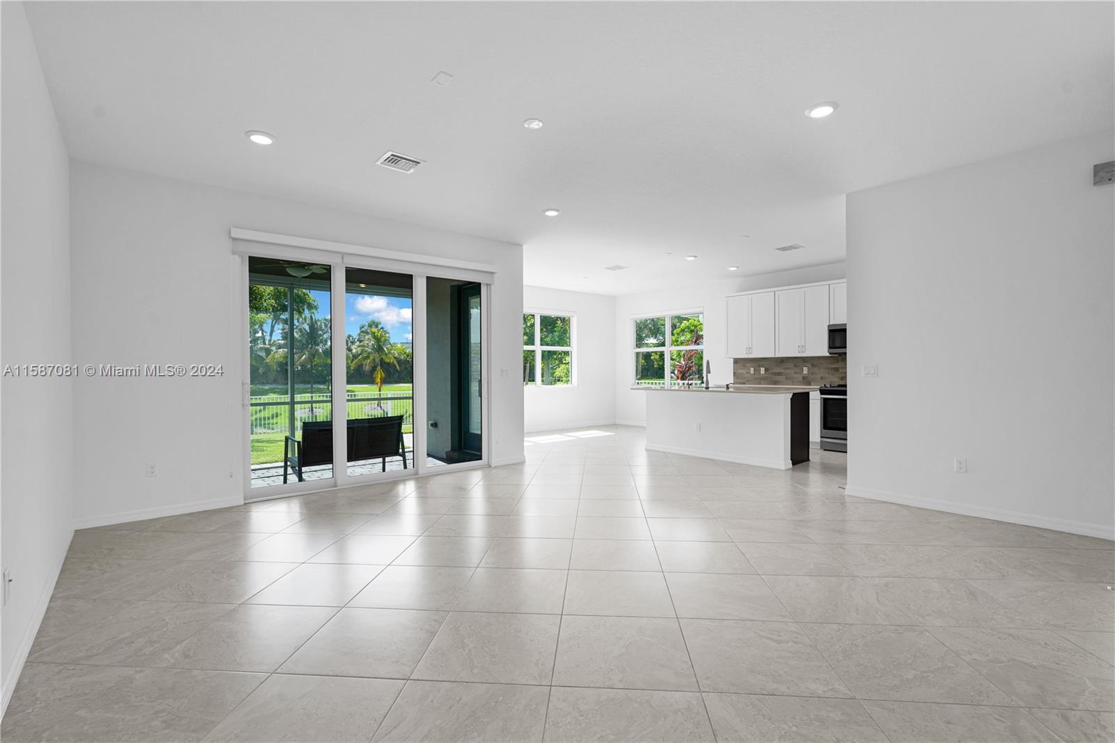 1595 Trailhead Terrace Hollywood, FL 33021 - Photo 3 of 49 a view of an empty room with kitchen and windows
