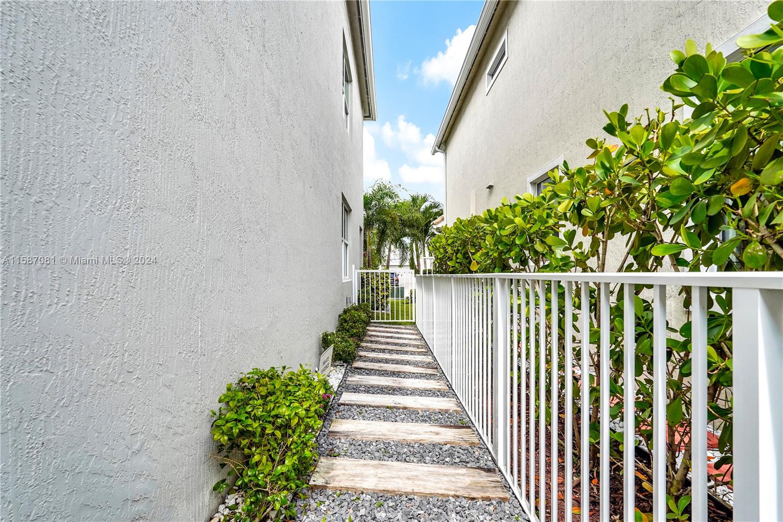 1595 Trailhead Terrace Hollywood, FL 33021 - Photo 38 of 49 a view of a pathway with a white house