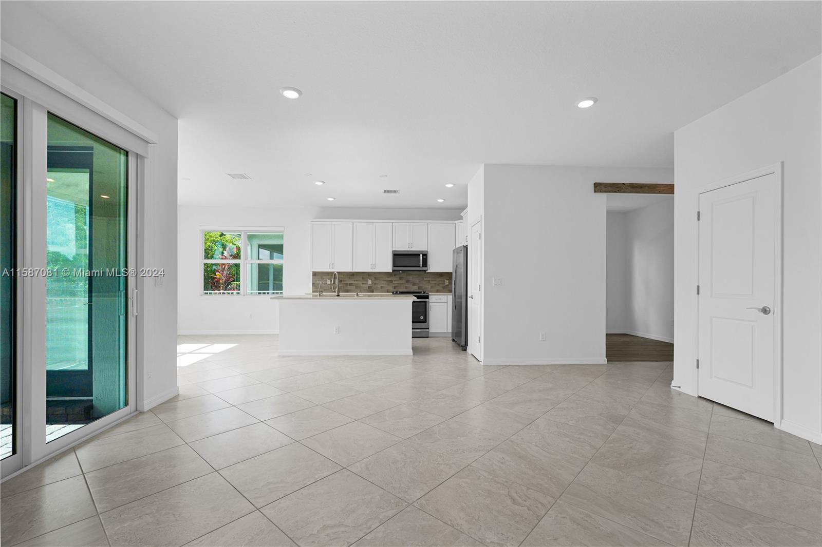 1595 Trailhead Terrace Hollywood, FL 33021 - Photo 4 of 49 a view of a kitchen with a sink and a refrigerator