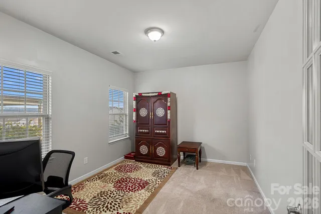 a view of workspace with furniture and window