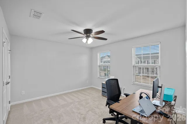 a workspace with furniture and a window
