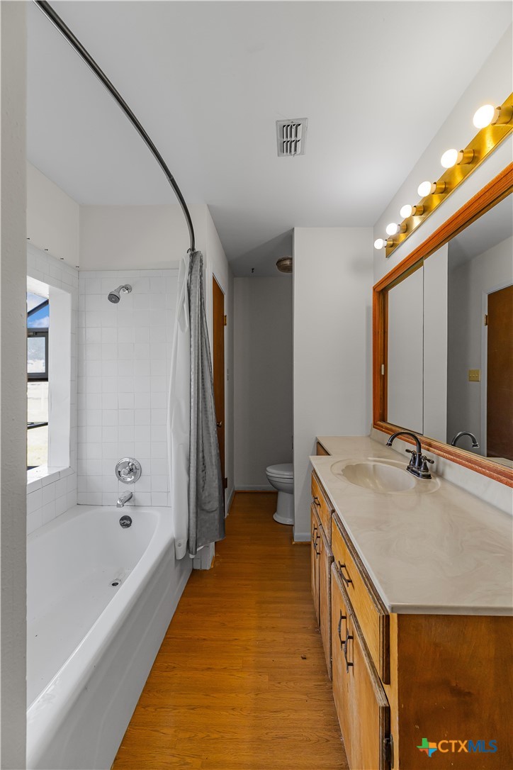 20 Hambleton Road Victoria, TX 77905 - Photo 26 of 48 a bathroom with a granite countertop sink and a bathtub