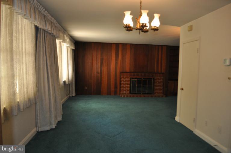 7915 Ruxway Road Towson, MD 21204 - Photo 14 of 14 a view of a chandelier in a room
