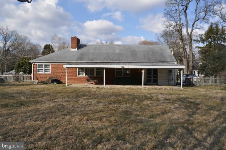 7915 Ruxway Road Towson, MD 21204 - Photo 3 of 14 front view of a house with a yard