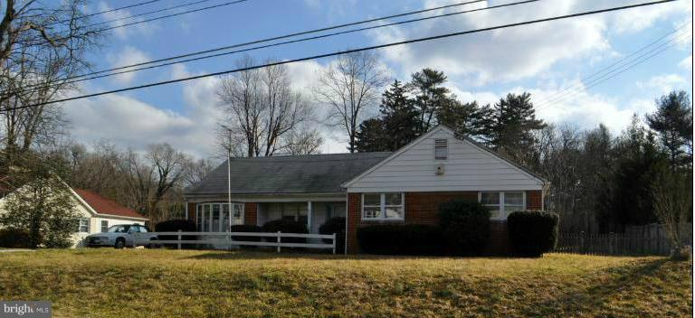 7915 Ruxway Road Towson, MD 21204 - Photo 4 of 14 a front view of a house with a yard