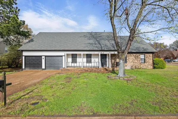 front view of a house with a yard