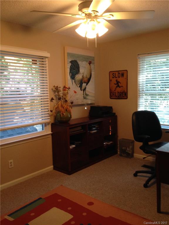 27091 Village Drive Tega Cay, SC 29708 - Photo 14 of 19 a room with a desk and a potted plant