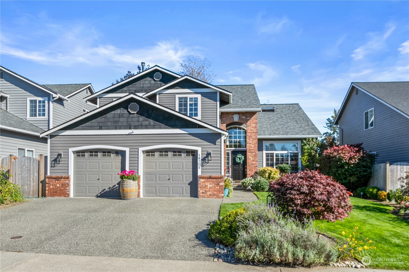 a front view of a house with garden